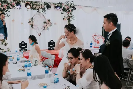 Wedding photo: bride groom guests vietnamese reception