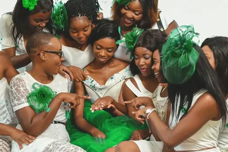 Wedding photo: bridesmaids green fascinator hats ring