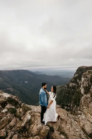 Wedding photo: couple rocky mountain cliff valley