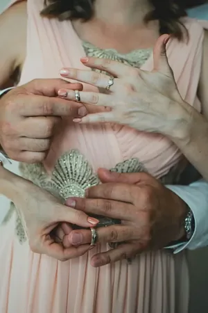 Wedding photo: couple wedding rings closeup