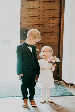 Wedding photo: ring bearer flower girl church door