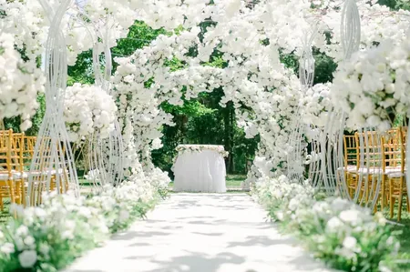Wedding photo: white floral arch ceremony aisle 2